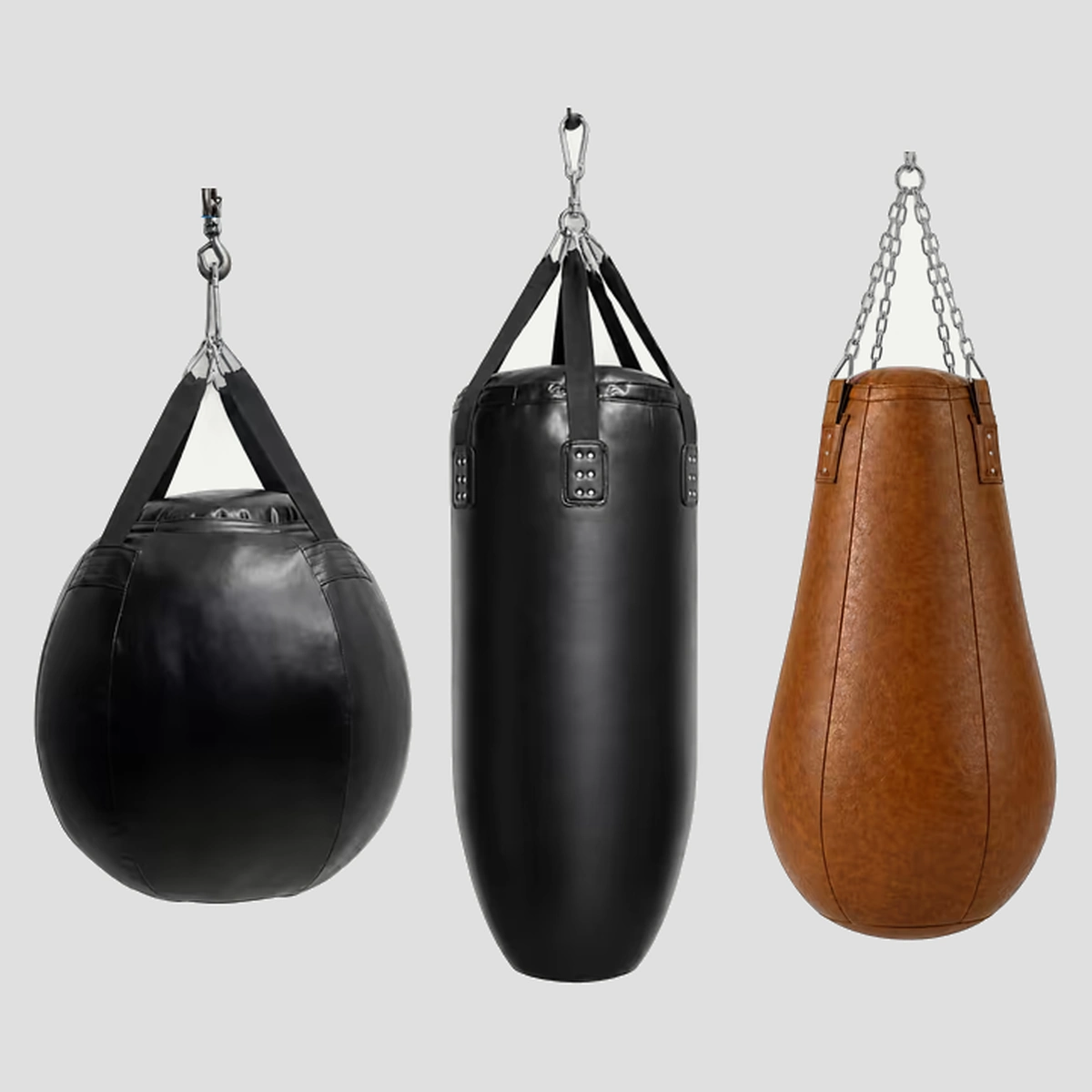 3 commercial hanging punching bag styles: round wrecking-ball, straight heavy bag and brown teardrop bag